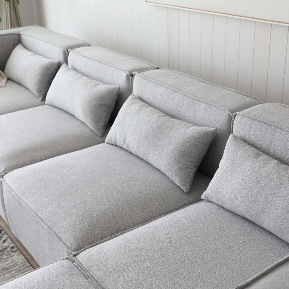 Sofá modular 4 plazas con 2 esquineros y 1 Puff Capri gris